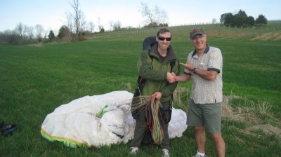 Bacil, who landed here in 2013 and previously, congratulating Matt, the first paraglider pilot to land at North Mountain Vineyards.