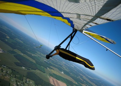 Adjusting my harness pitch while Jim Rooney initiates his return to Highland