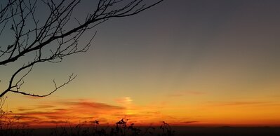 Sunset from a ledge to the left of launch. We retreated there to get away from the crowd.