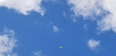 Jim circling the field as a sailplane tows up (well) above him.