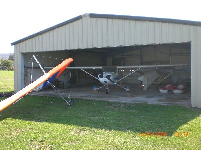 Parked by the hangar.  Cessna 150 and Kolb ultralight.