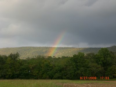 A rainbow forms in front of launch.