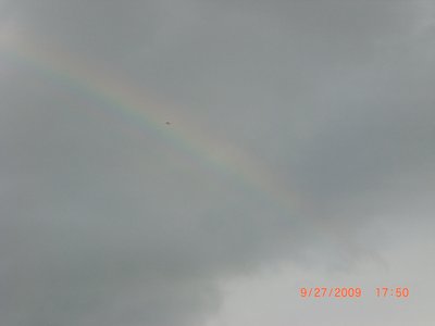 Somewhere over the rainbow, way up high, John D. flies in front of the rainbow, why oh why didn't I?