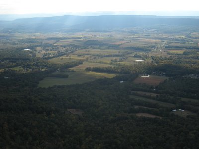 The view out front: LZ, valley, and the upwind ridge.