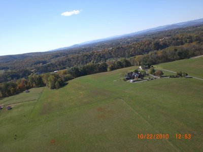 Mr. Karmy's airstrip and house.  The windsock is at the corner of the corral.