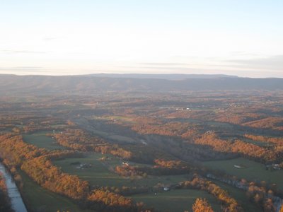 Sunset highlighting the treelines in the valley.