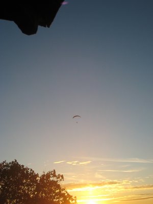 Unidentified PG pilot enjoys sunset from the best vantage there is....