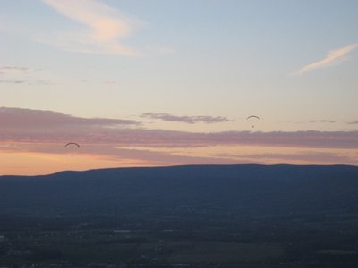 Two unidentified PG pilots head toward the LZ at the end of a great day.